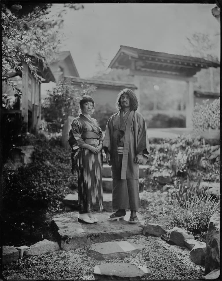 Couple wearing kimono in a Japanese garden, tintype