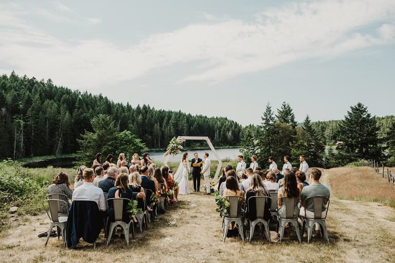 Guests seated for a lakeside ceremony at Bullock Lake Farm