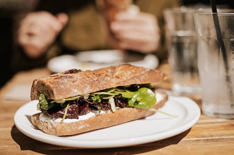 Beet and greens baguette sandwich served at Oxeye on Galiano