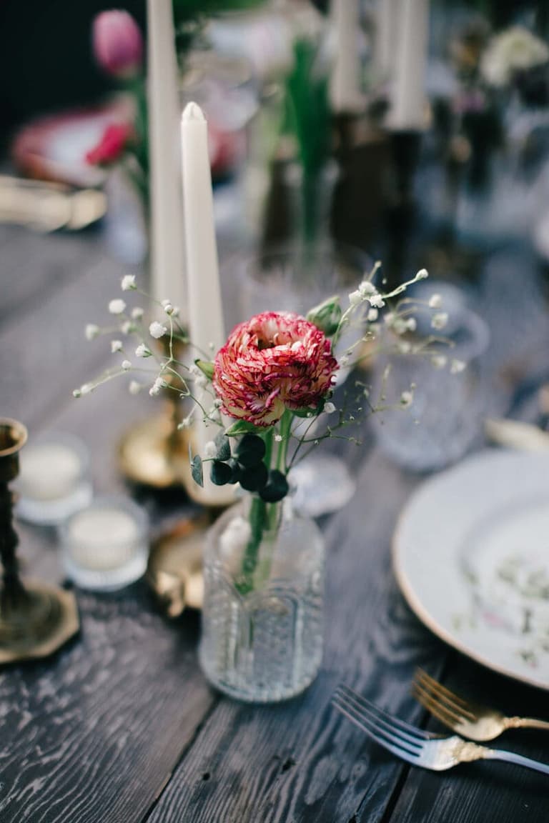 Vintage tablescape with ranunculus and tapers by Old New Borrowed Blue