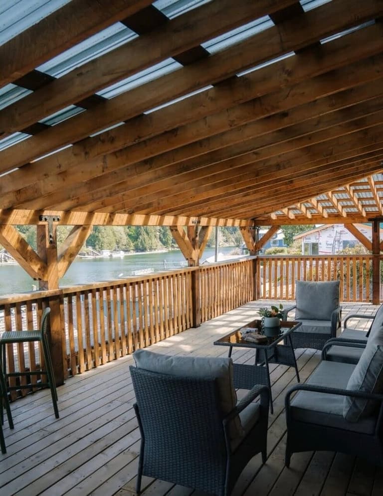 Timber-frame covered deck overlooking the harbour at Flora's