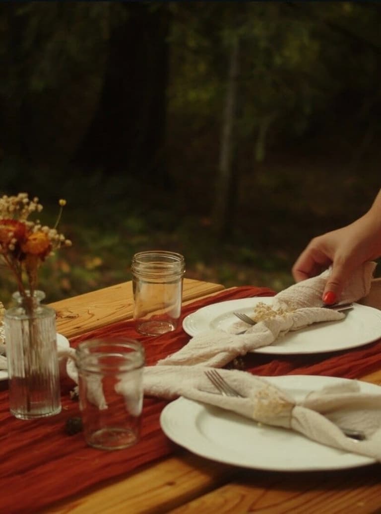 hands setting table at Nanaimo wedding venue
